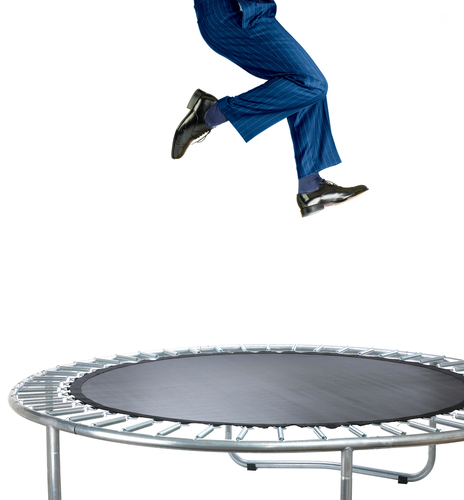 child jumping on a trampoline